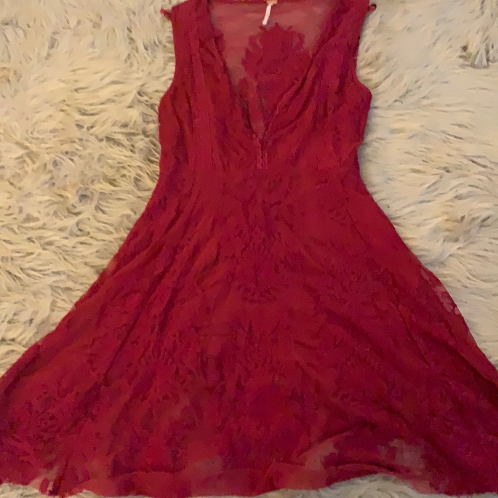 Super cute red dress! Lace detail and fitted around waist with an elegant flow.